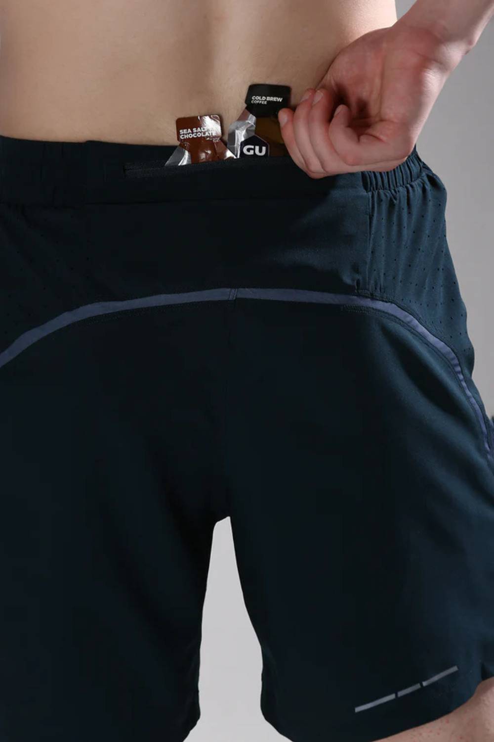 Zippered back pocket of men’s Pulse Cross Training Shorts securely holding gel #Color_Bristo Lake